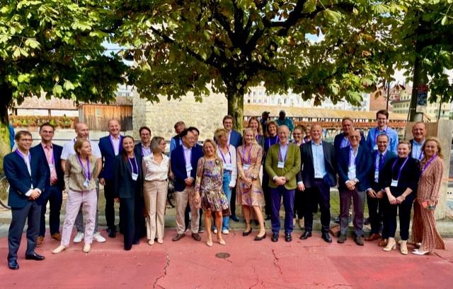 Groepsfoto tijdens de fysische meeting in Luzern (dr. Poortmans staat op de tweede rij, helemaal rechts).